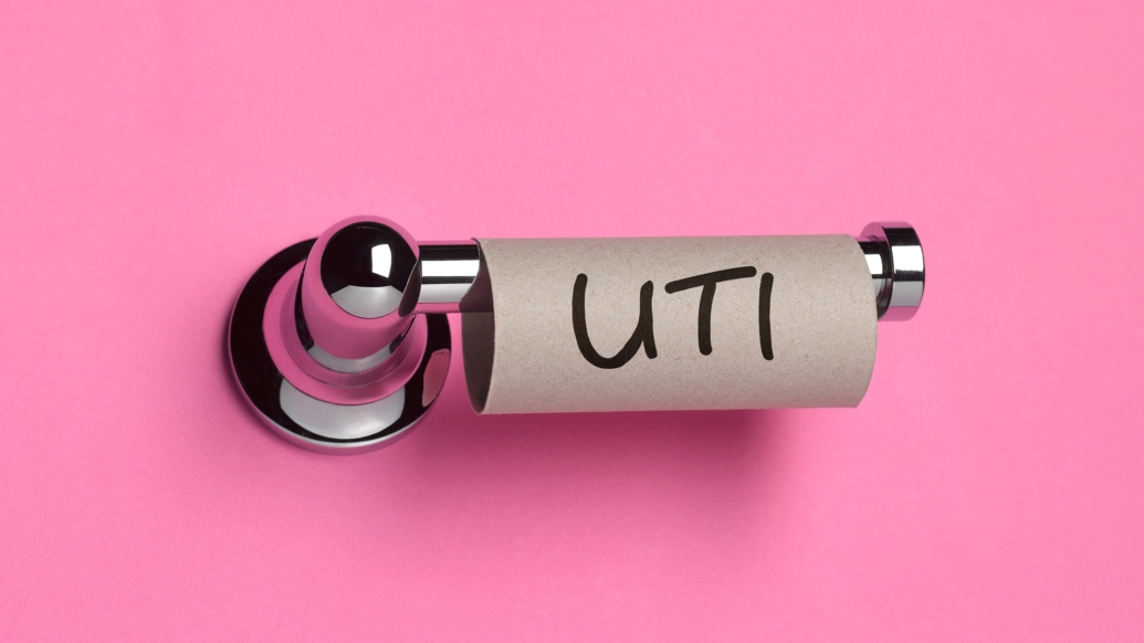 An empty toilet paper roll with the word UTI written on it